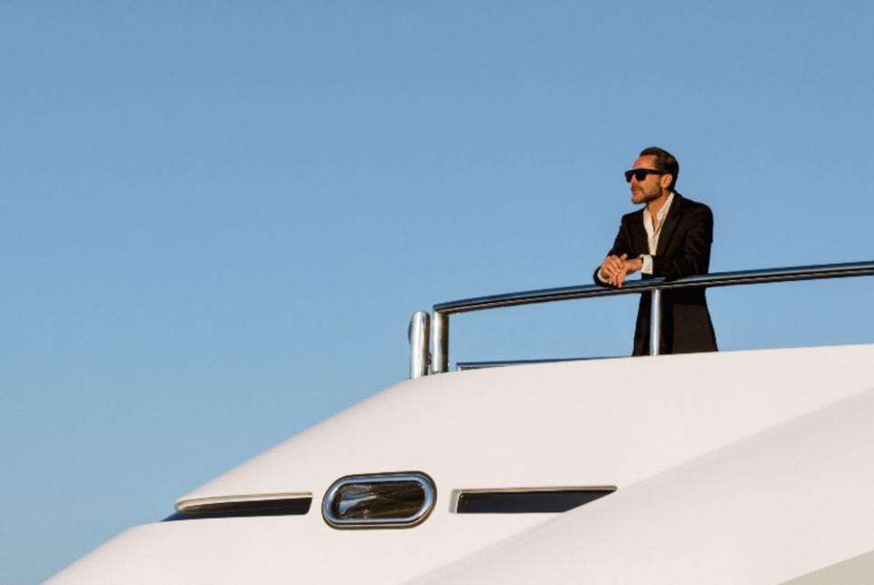 A man looking out from his superyacht
